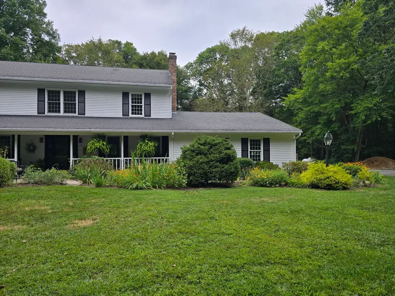 Mowed lawn and maintained plantings after a weekly lawn maintenance visit
