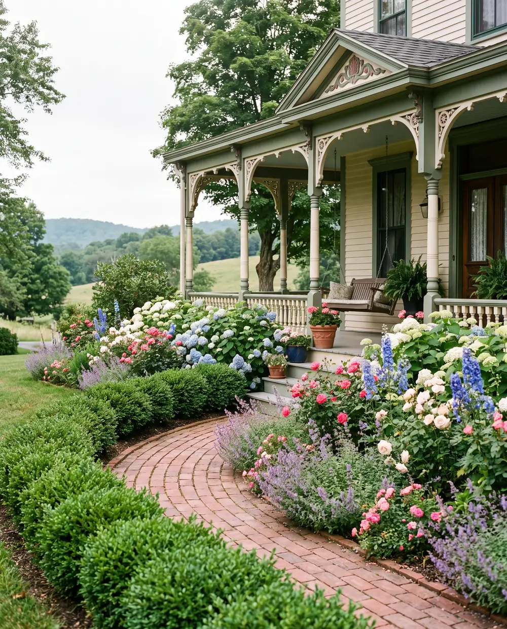 Brick path lined with low boxwoods and flowers leading to a Victorian porch