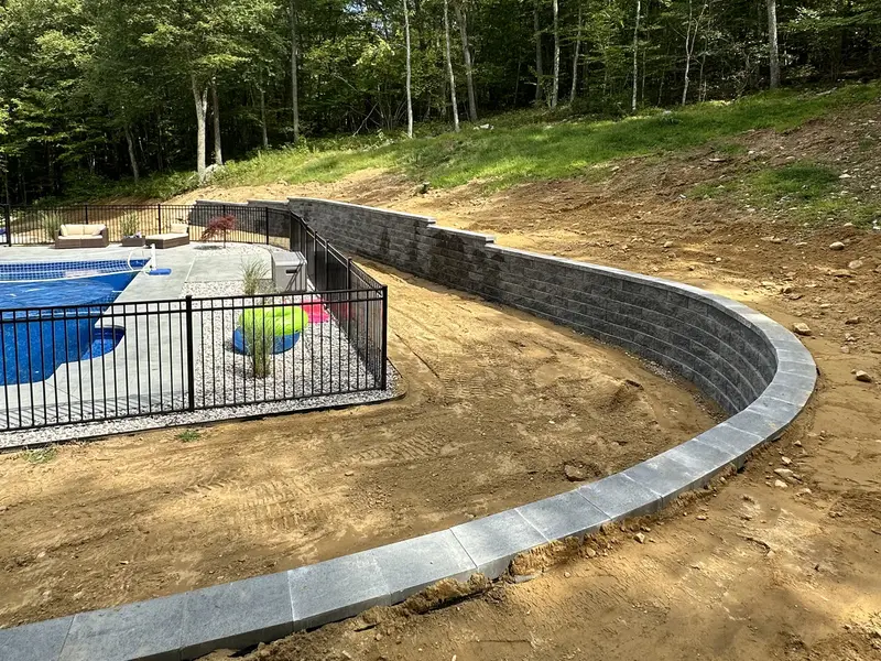 New retaining wall and grading that solved a drainage problem